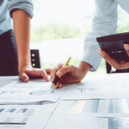 Two business owners preparing for change and looking through business plans