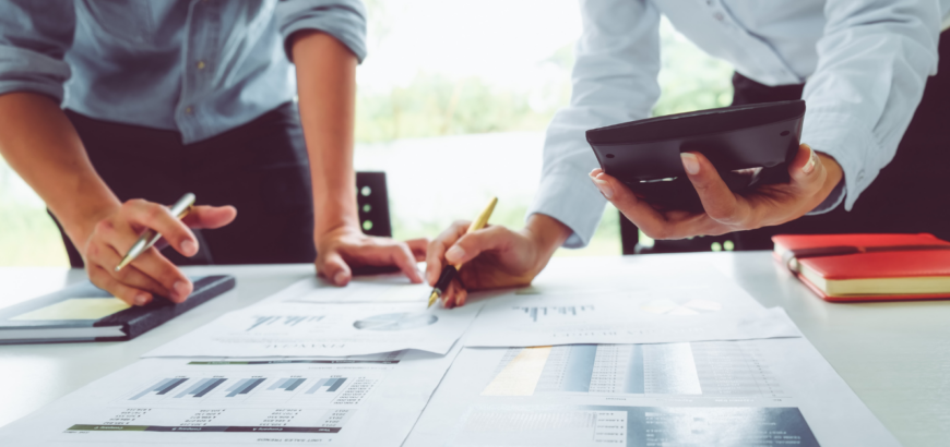 Two business owners preparing for change and looking through business plans